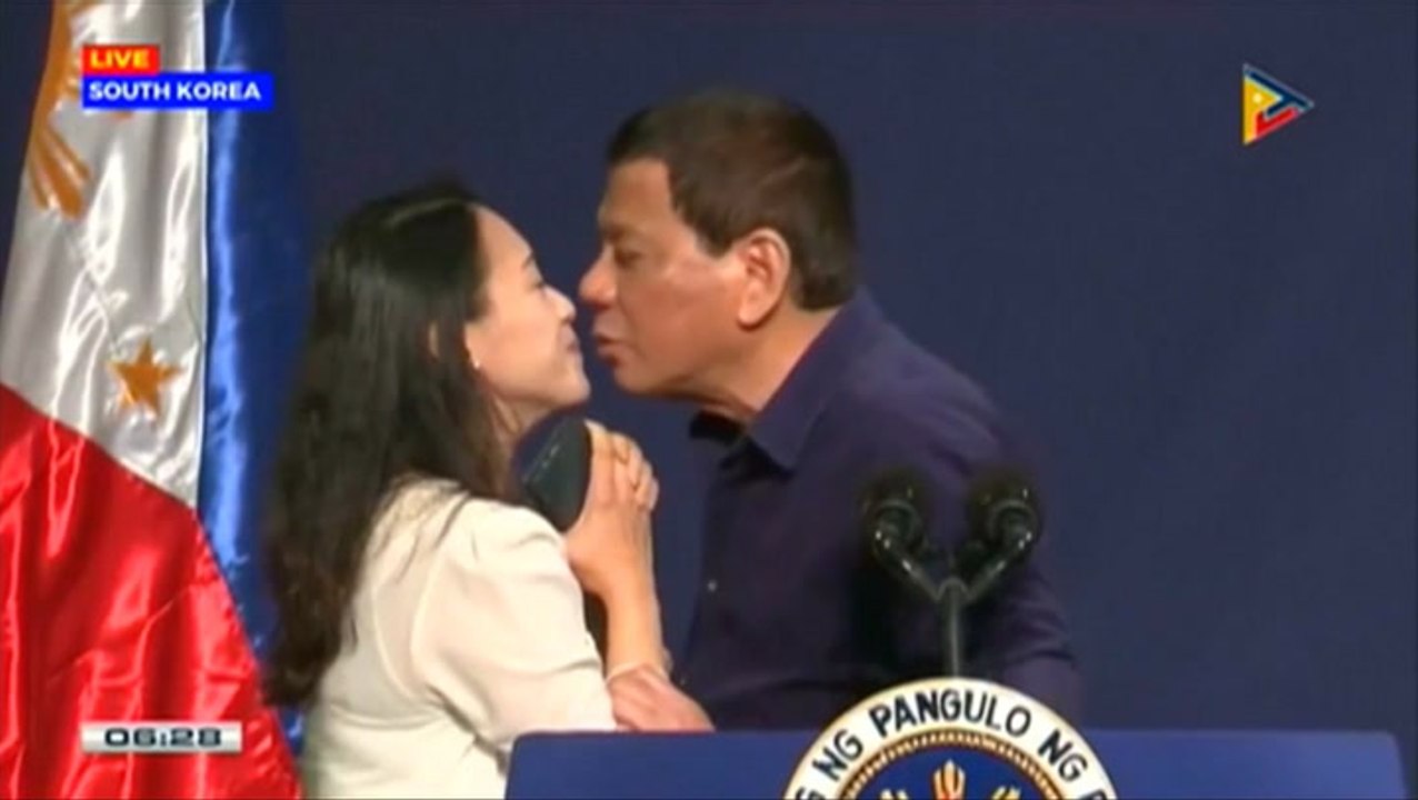 Philippines' Duterte stirs controversy by kissing woman on lips
