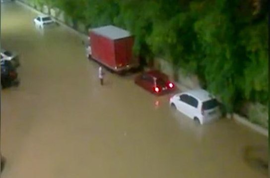 Sungai Batu overflows during downpour
