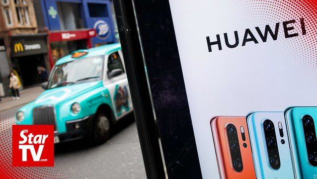 UK PM May fires defense minister over Huawei leak