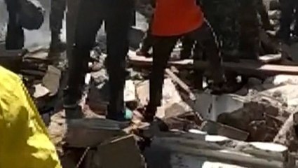Woman rescued from rubble of Lombok quake after two days