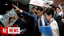 Hong Kong policy address halted after heckling