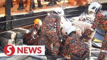 Bomba rescues man trapped under overturned crane in Cheras