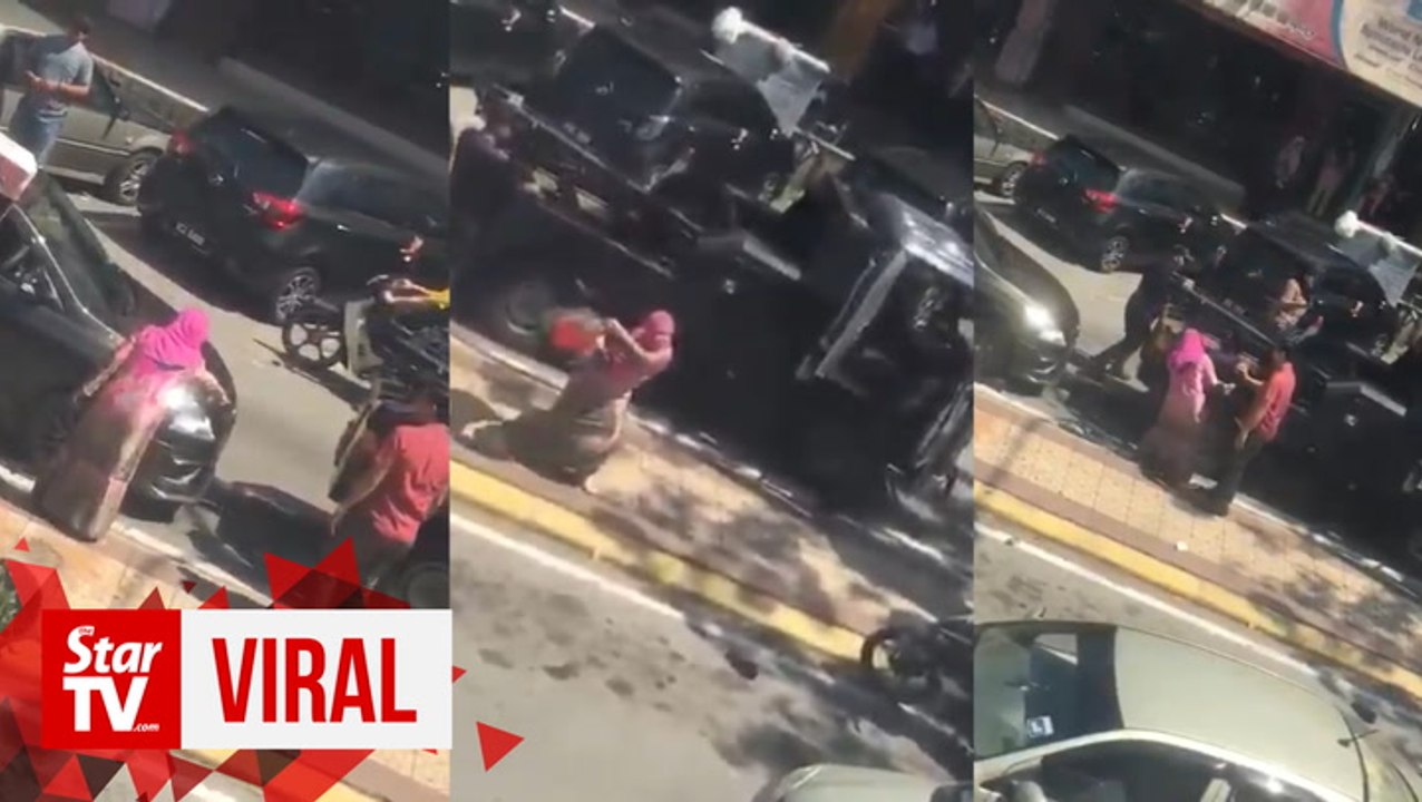 Woman shouts, spits and assaults council workers for towing her car