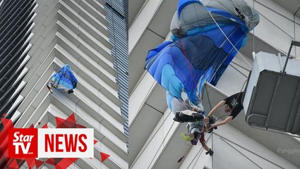 Putrajaya Base Jump participant gets stuck at side of building, brought down safely