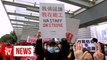 Striking Hong Kong health workers rally at government offices