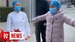 Chinese nurse in coronavirus-hit hospital gives sobbing daughter ‘air hug’