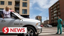 Go to China! Denver lockdown protester yells at medic blocking traffic