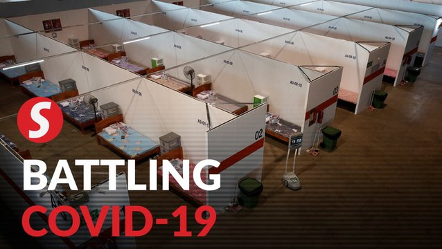 Singapore races to build beds for Covie-19 patients as cases surge