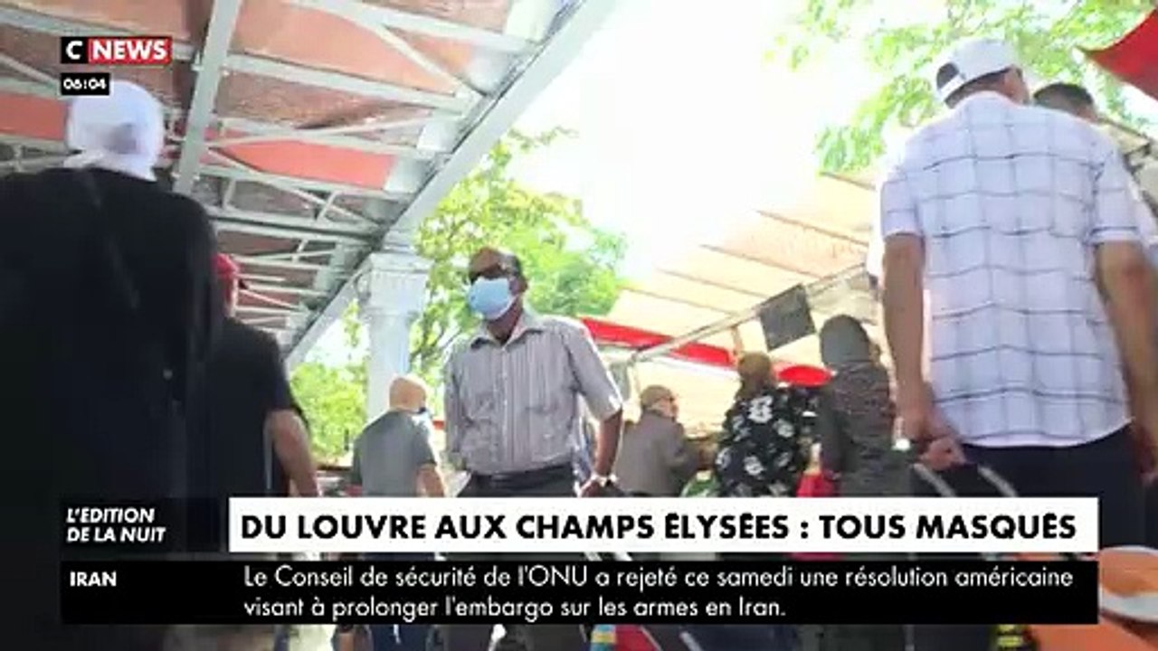 Coronavirus - Regardez ces parisiens sur les Champs-Elysées assez peu convaincus par la nécessité de porter des masques