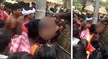 VIRAL VIDEO: गांव वालों के सामने पति ने की पत्नी के साथ हैवानियत, खंभे से बांधकर काट दिए बाल