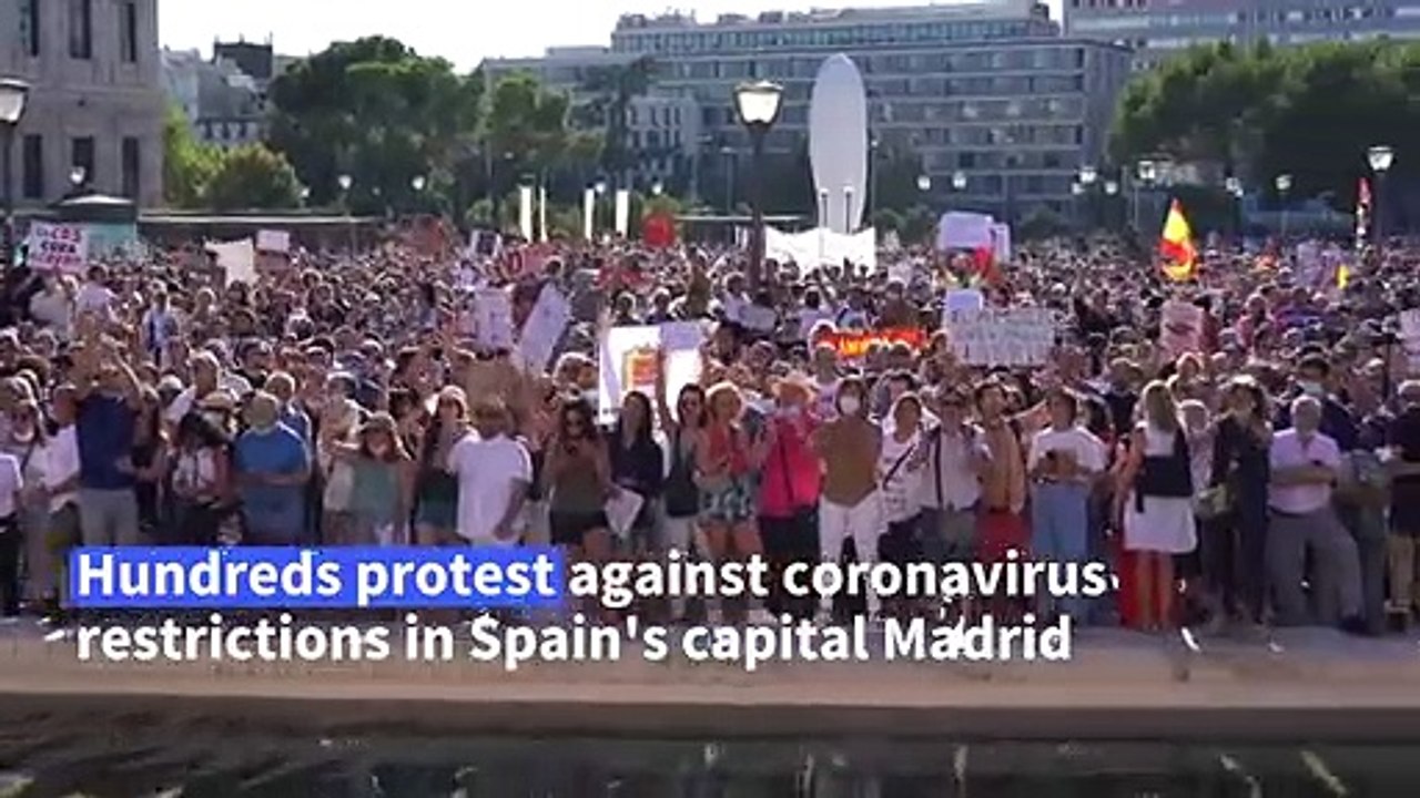 Hundreds protest in Spain against virus restrictions