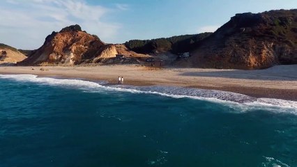 Couple taking a walk at the beach.