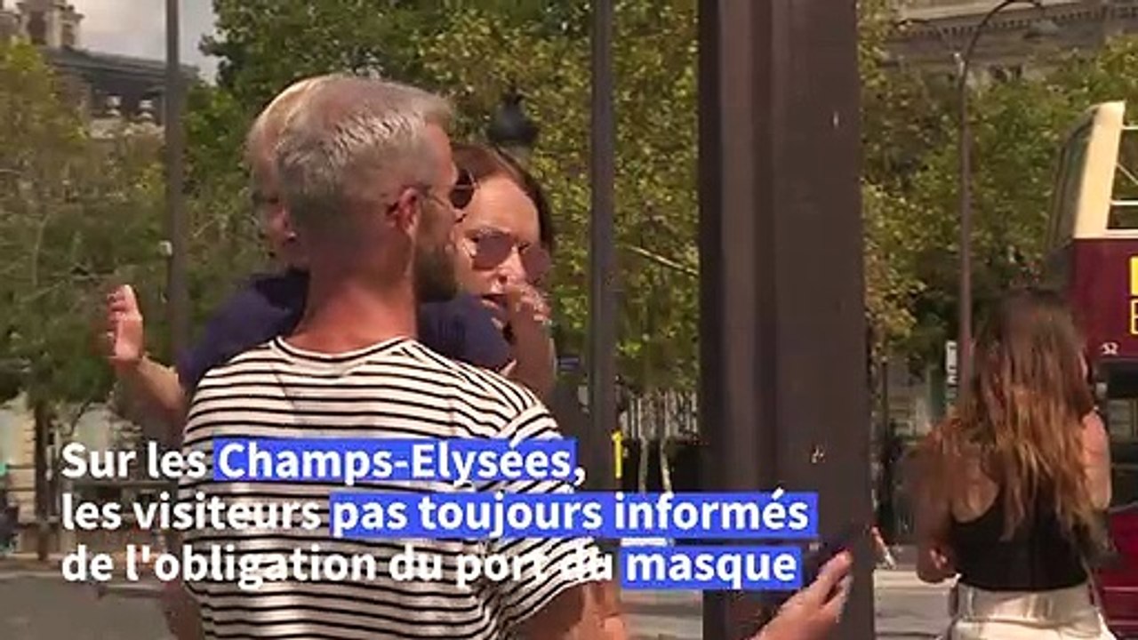 Sur les Champs-Elysées, les touristes encore peu informés mais souvent masqués