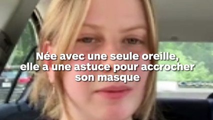 Une fille avec une seule oreille attache une ventouse pour porter un masque