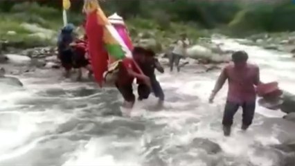 People risking their lives in flood