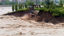 Massive evacuation under way in southwest China as floods trigger unprecedented alert