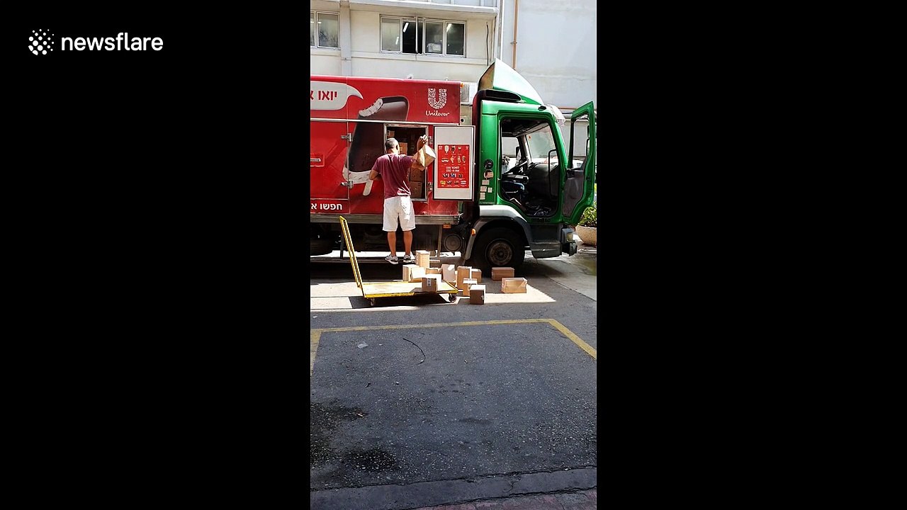 Bad day at the office? Careless delivery driver throws goods on floor at Israeli factory