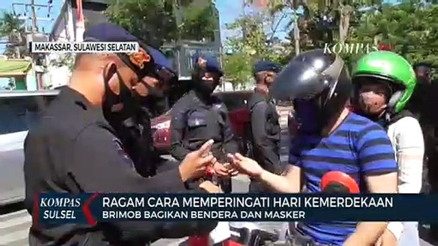 Brimob Polda SulSel Bagikan Bendera Dan Masker