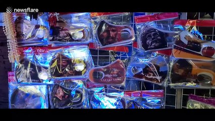Face masks depicting Jesus sell out outside Philippines church