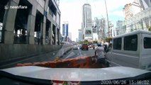 Weird moment plastic barriers blow into road blocking traffic
