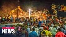 At least 100 feared trapped as apartment building collapses in India