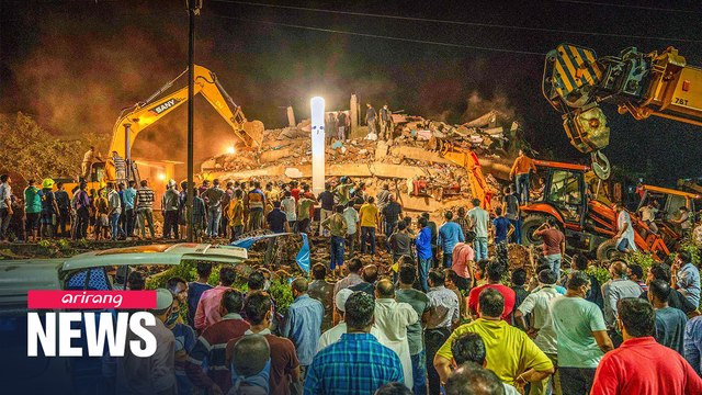 At least 100 feared trapped as apartment building collapses in India
