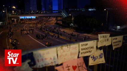 Hong Kong demonstrators defy authorities, continue protests after permit expires