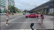 Tourists filmed juggling at intersection in Kota Kinabalu