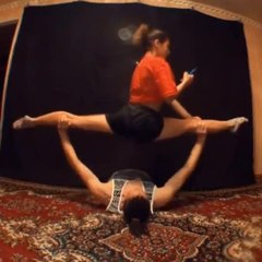 Guy Lifts Girl Doing Split While Weight Lifting