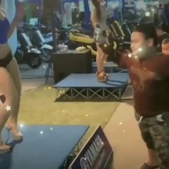 The boy is very excited to dance in front of the beautiful girl singing