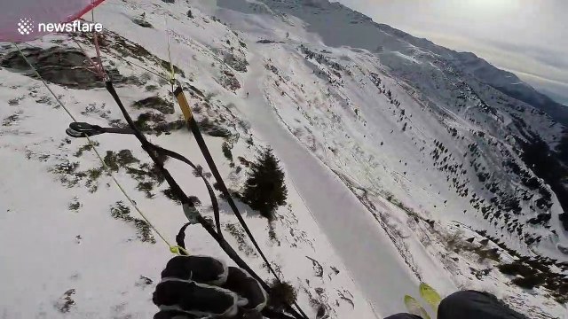 Speed-rider flies down Alpine mountainside just inches above treetops