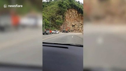 Landslide blocks road after heavy rain in the Philippines