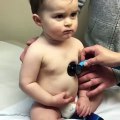 Sweet baby boy rests head on nurse_s hand(480P)_1