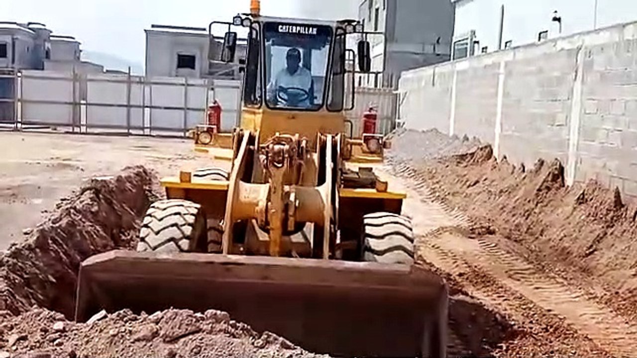 Caterpillar big wheel loader digging boundaries  outside home.|part 1|