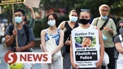 Black man shot by police in Wisconsin paralysed