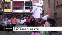 Musicians try to lift spirits in COVID-hit Brazilian favela