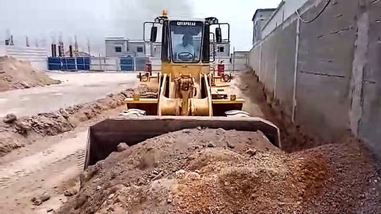 Caterpillar big wheel loader digging boundaries outside home.|part 2|