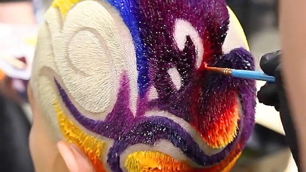 Hair colorist paints rainbow designs onto geometric buzz cuts