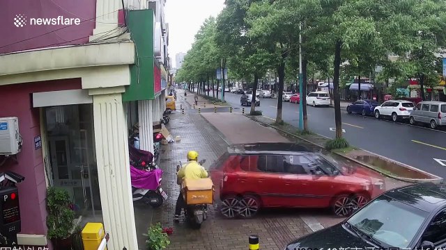 Car reverses into deliveryman and pushes him into shop after Chinese motorist with heels accidentally presses accelerator