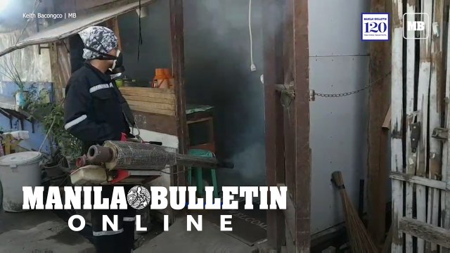 Personnel of the City Health Office conducts an anti-dengue fogging operations in Davao City