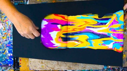 Artist creates fluid art with a dustpan
