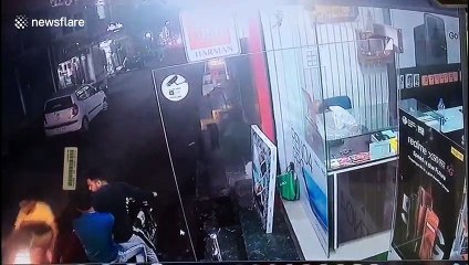 CCTV captures terrifying moment two bulls slam into men on motorbike