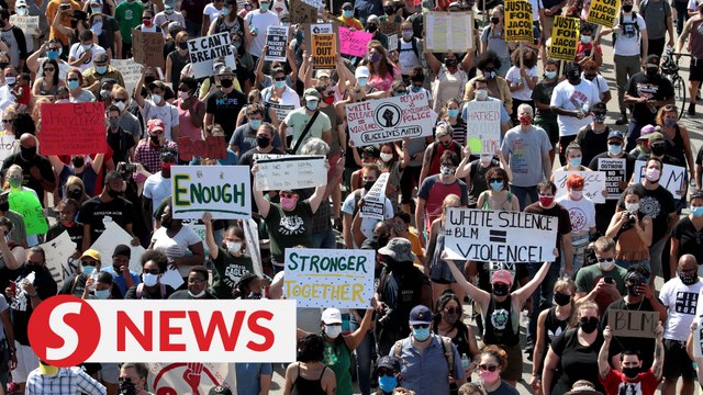 Anti-racism demonstrators march in Kenosha