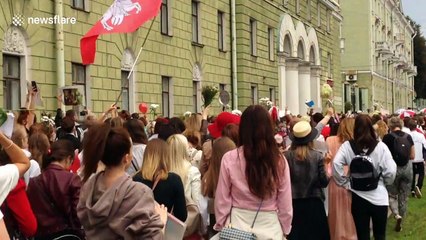 Drone flies opposition flag over anti-government march in Belarus