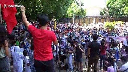 Protesters condemn Filipino President Duterte's government during remembrance holiday