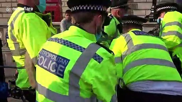 Large Extinction Rebellion protester requires 7 police officers to drag him away from London demonstration