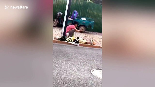 Vendor spotted using their mouth to spray water on vegetables in China