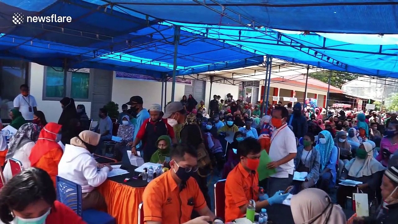 Communities affected by COVID-19 receive social assistance from Indonesian government