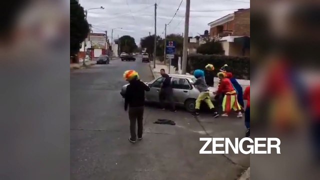 Spiderman, Minion, and team of clowns restart old man's stalled car