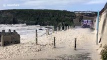 Watch as Storm Ellen brings swirling sea-foam and huge breakers crashing onto the Anglesey shoreline